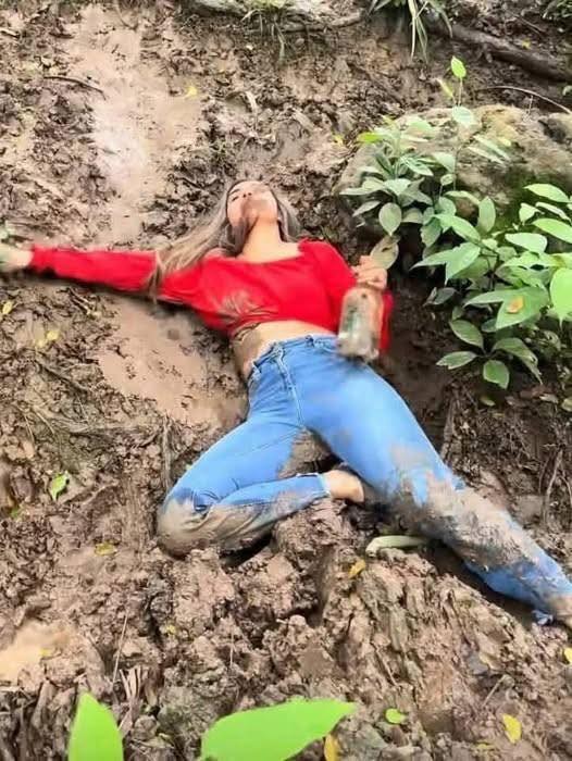 Young woman puts both daughters inside the fir… See more